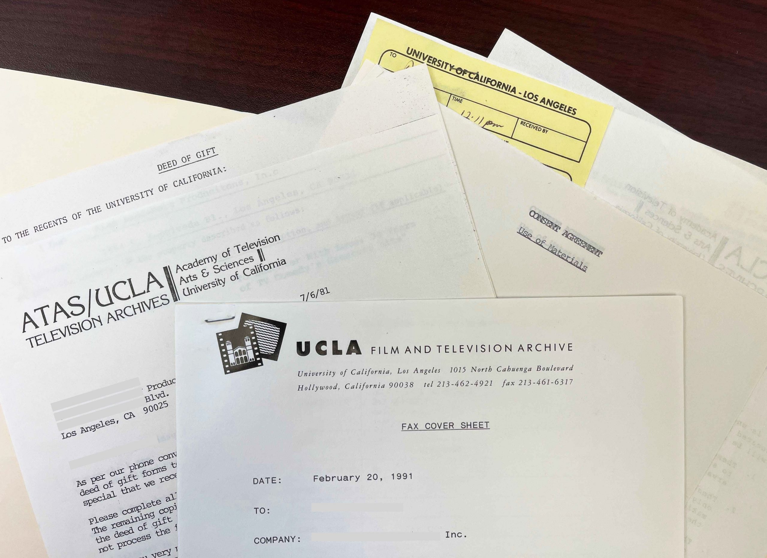 Various typed letters on a table.