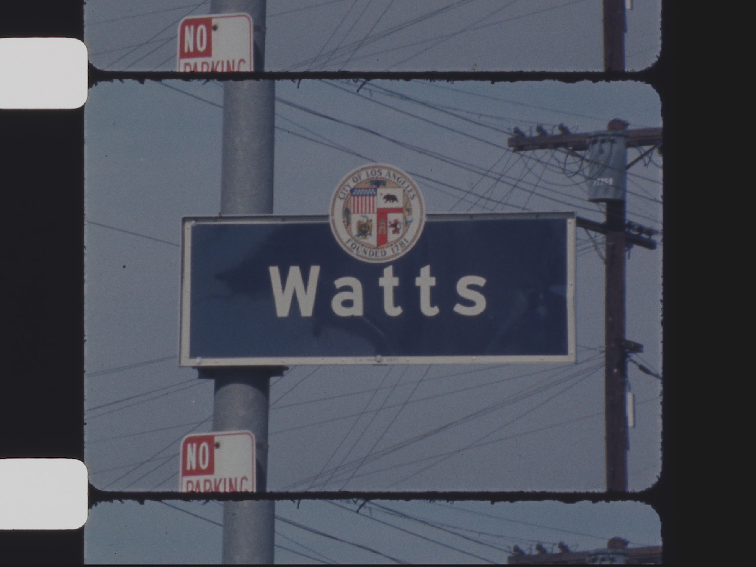 Film closeup of a Watts Los Angeles city sign.