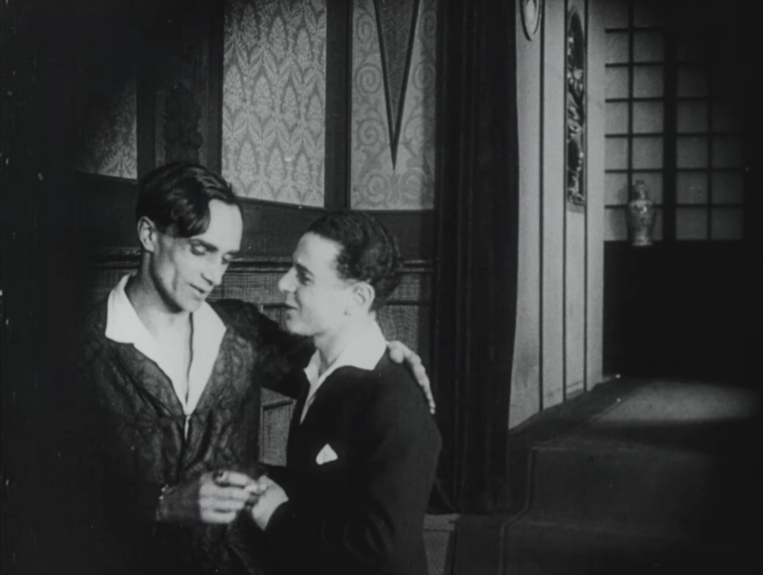 Conrad Veidt and Fritz Schulz talking to each other affectionately.