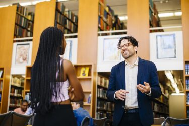 man talking to student