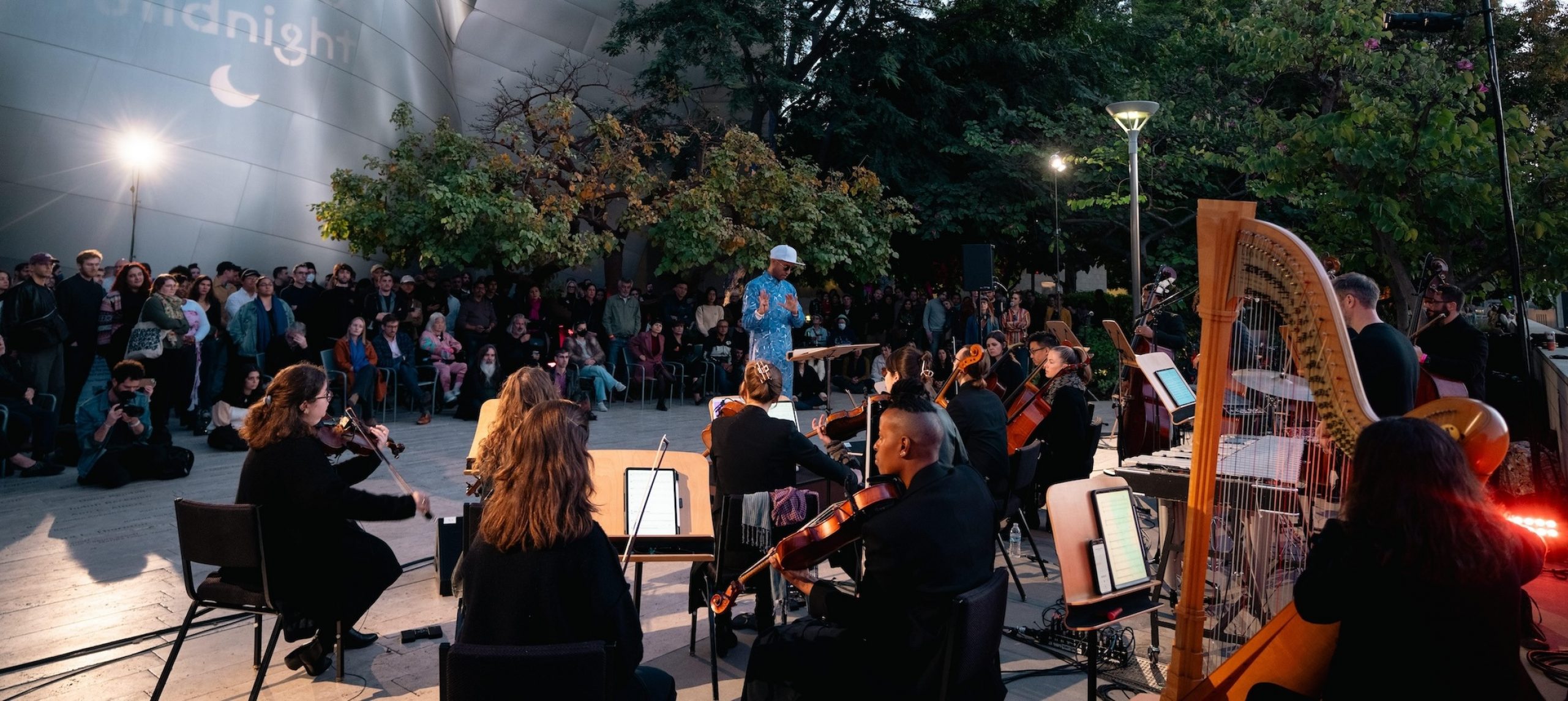 music ensemble on an outdoor stage