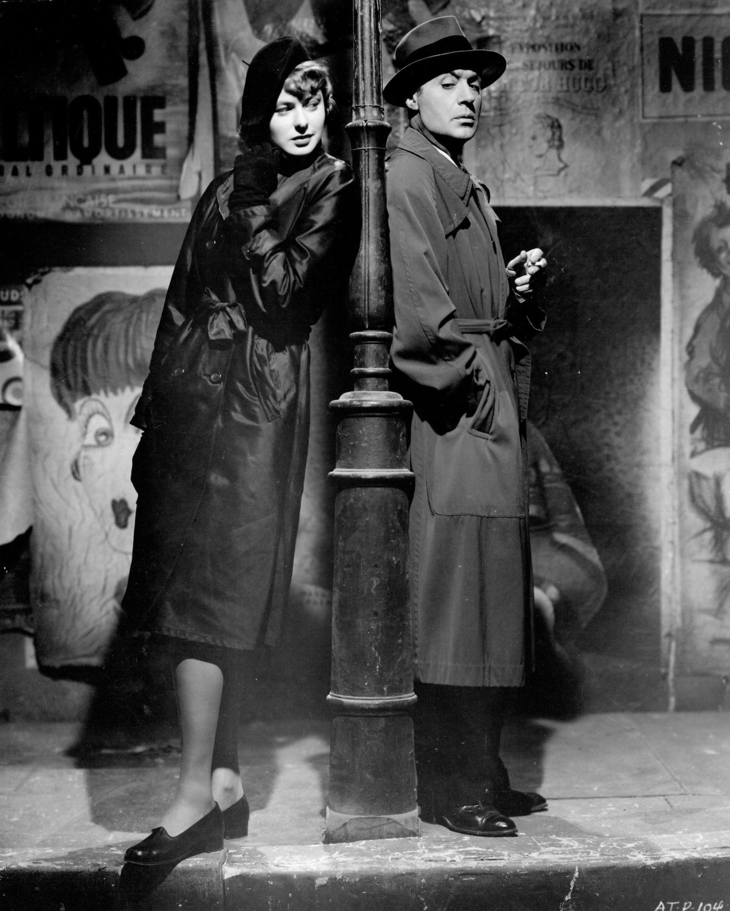 Man and woman standing against a streetlamp