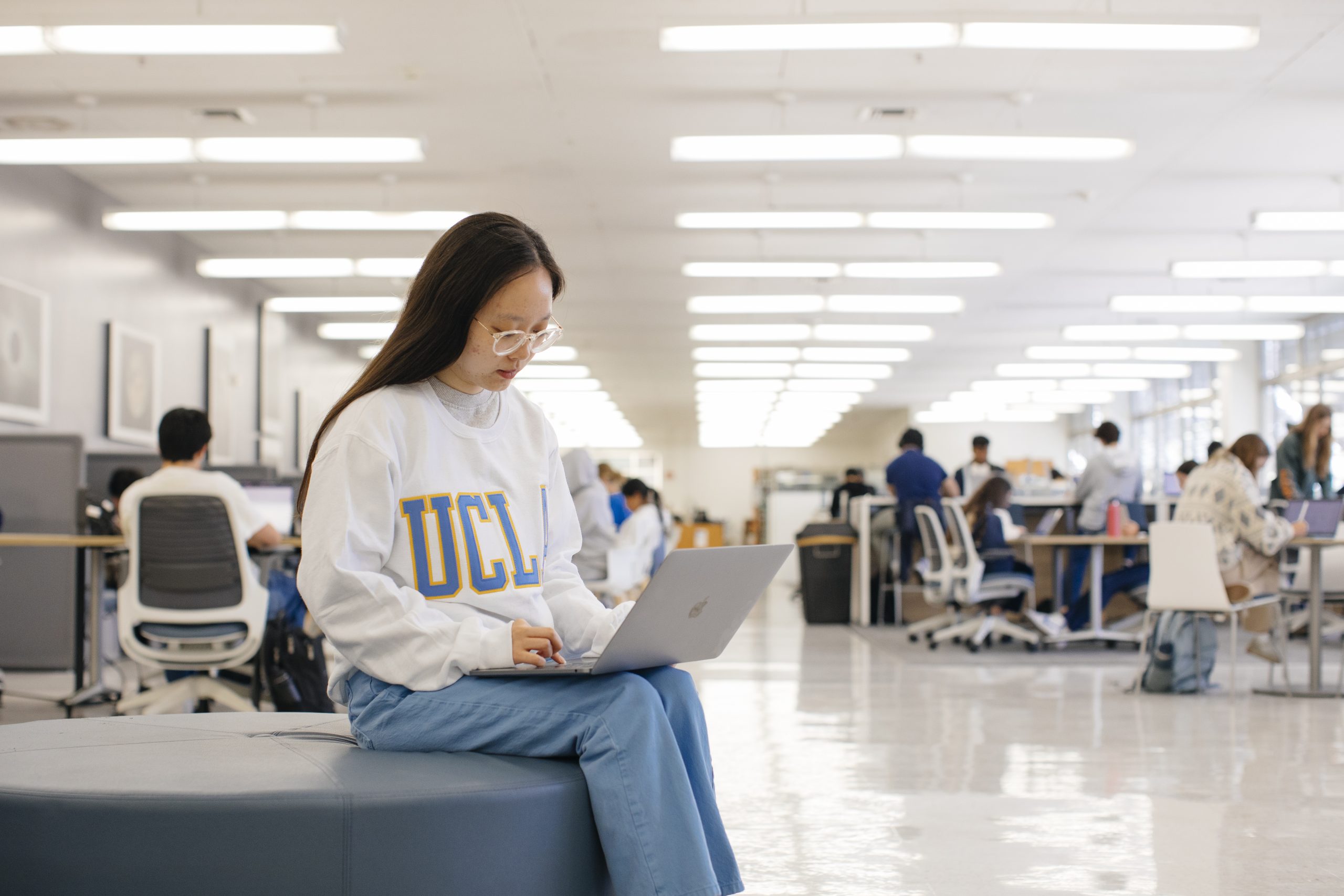 Student working on laptop at Science and Engineering Library