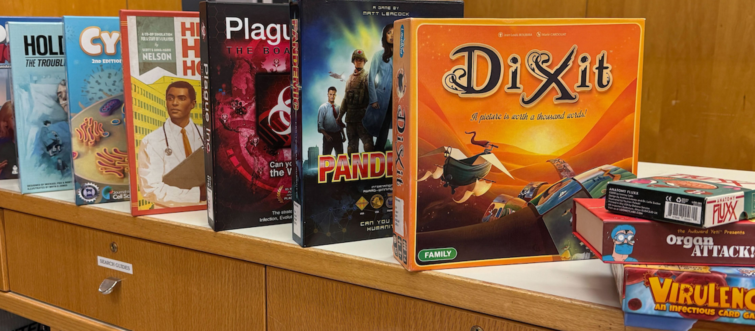 different board games lined up in a row