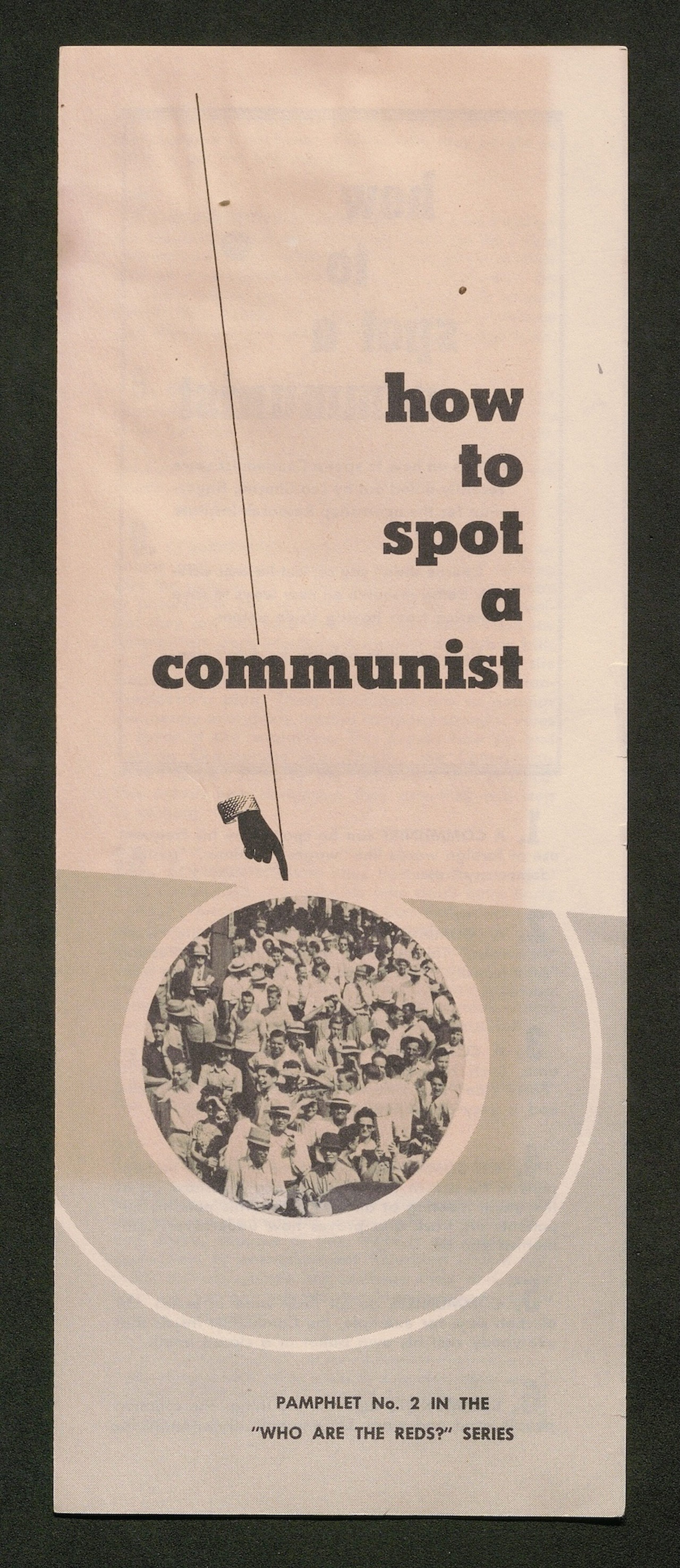 Pamphlet cover titled “how to spot a communist”. Circular image of a crowd of people. Subtitle: “PAMPHLET No. 2 IN THE ‘WHO ARE THE REDS?’ SERIES”