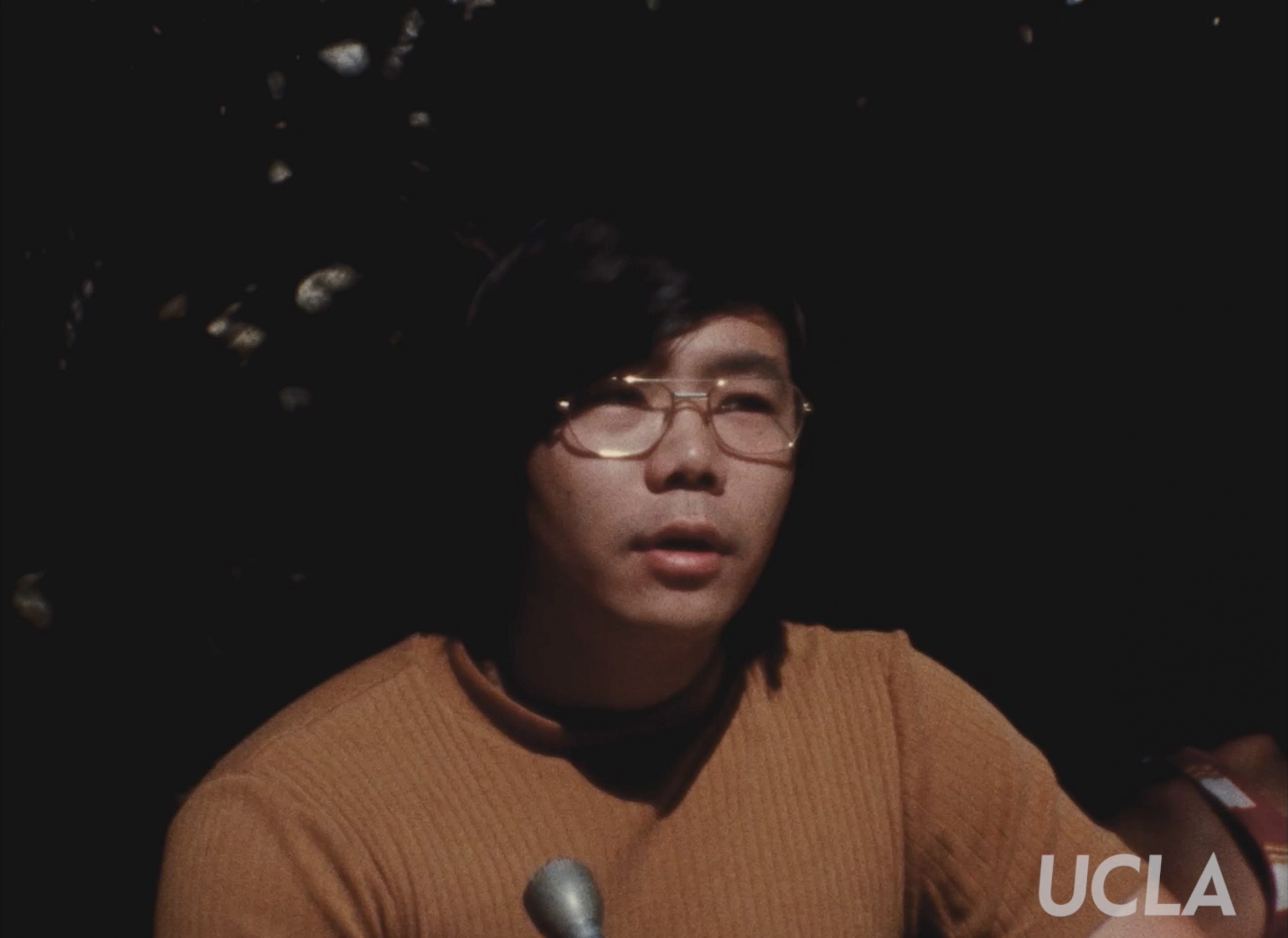 Young man speaking into microphone