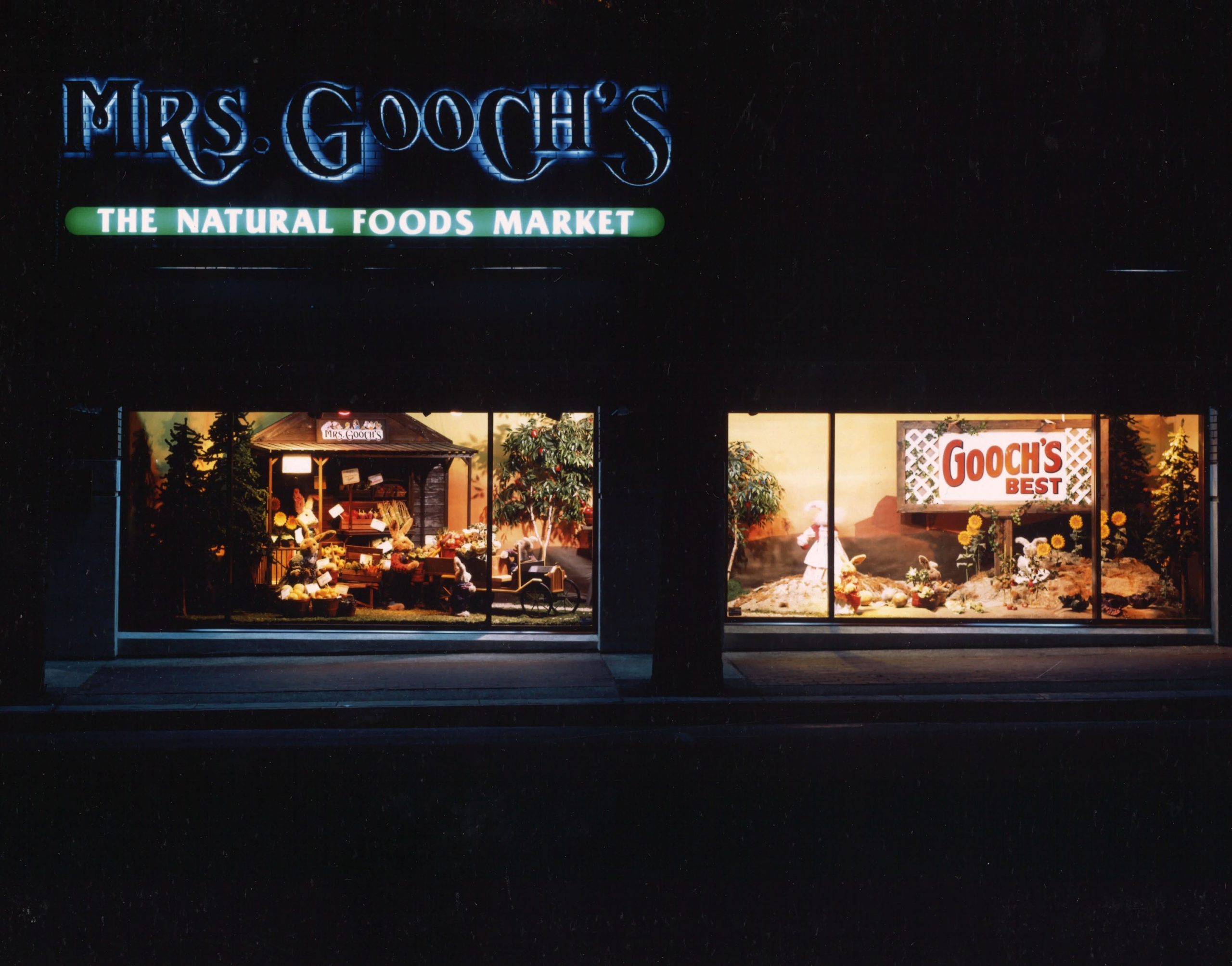 Mrs. Gooch's Natural Food Market window display at night