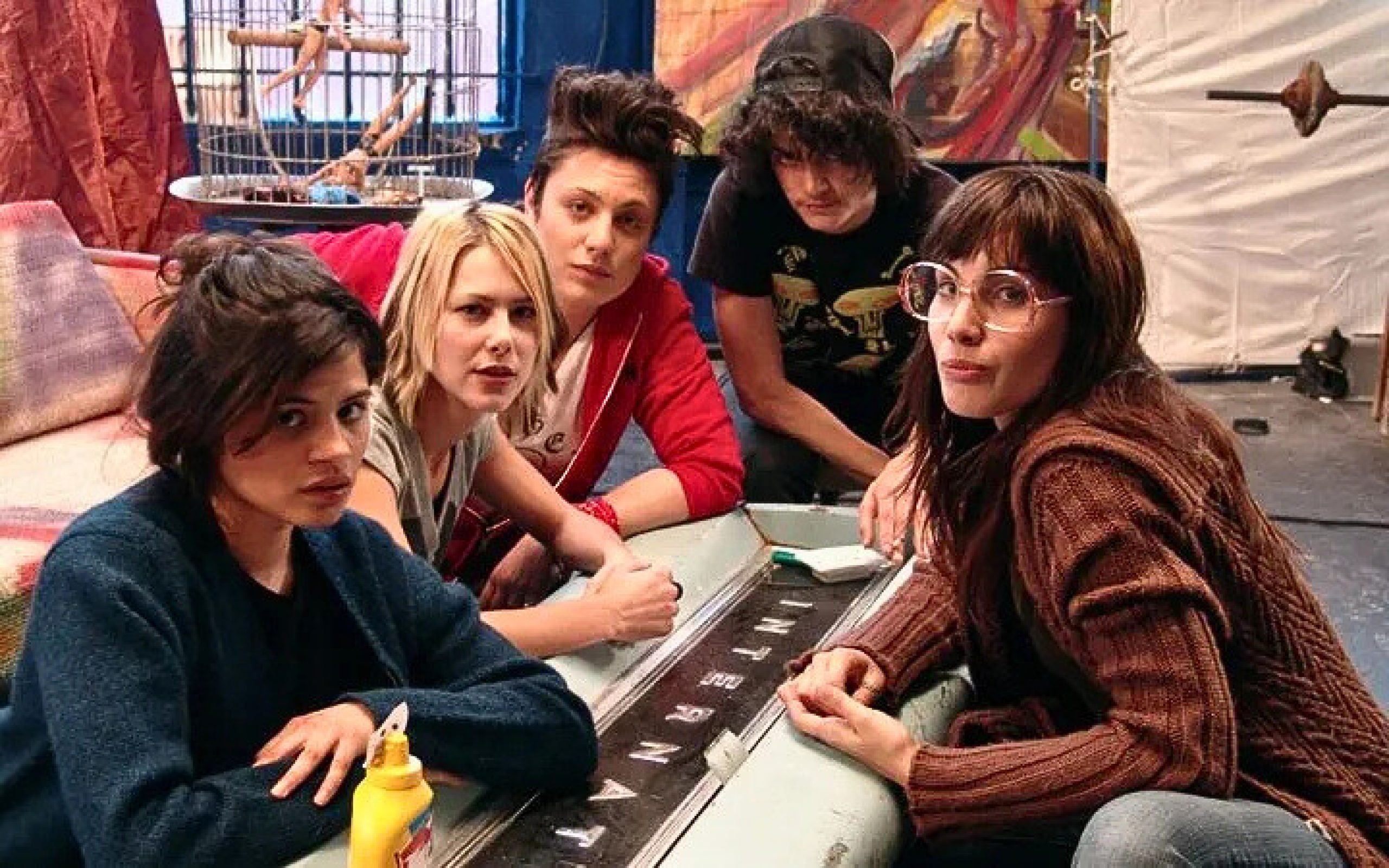 A group of young women looking at the camera in a judging manner