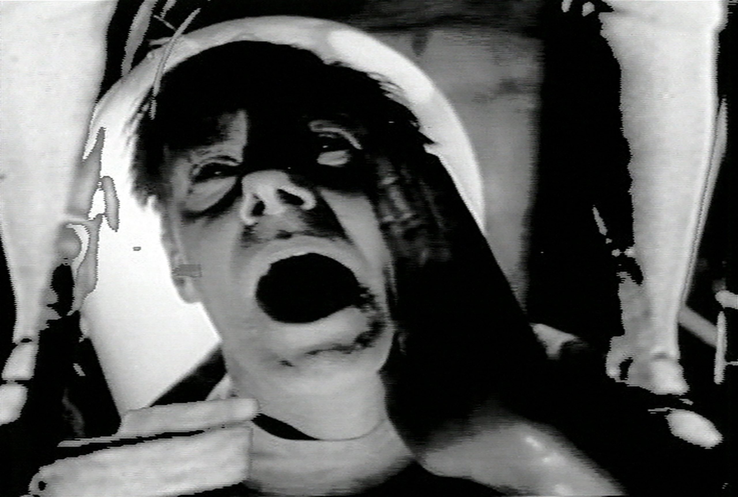 close up of man's face with mouth open wide