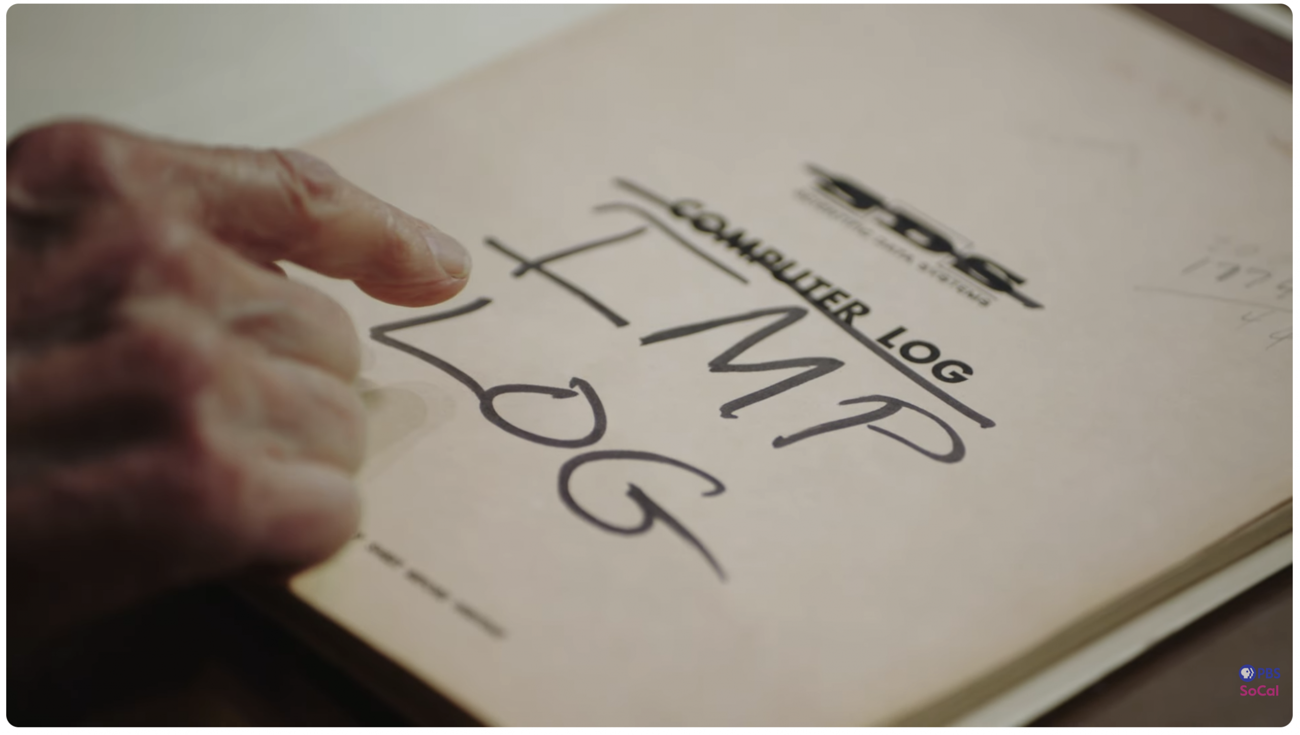 Prof. Kleinrock pointing to a computer IMP log