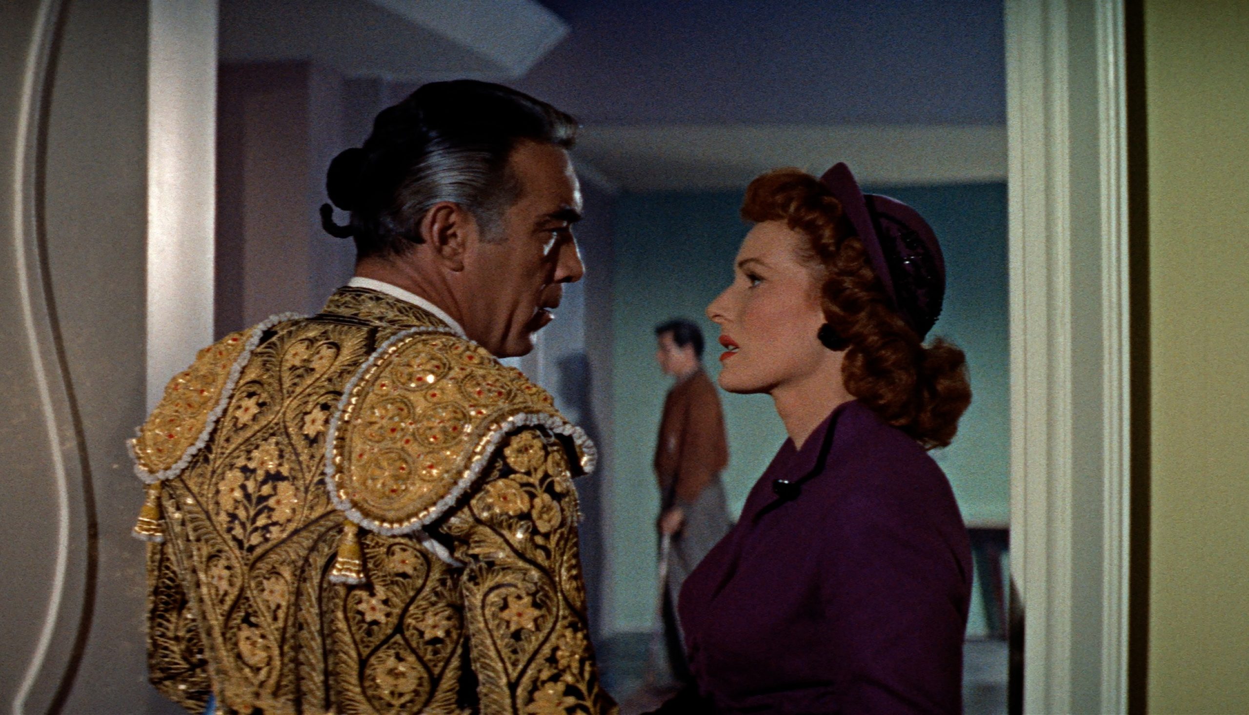 man in matador top talking to a woman