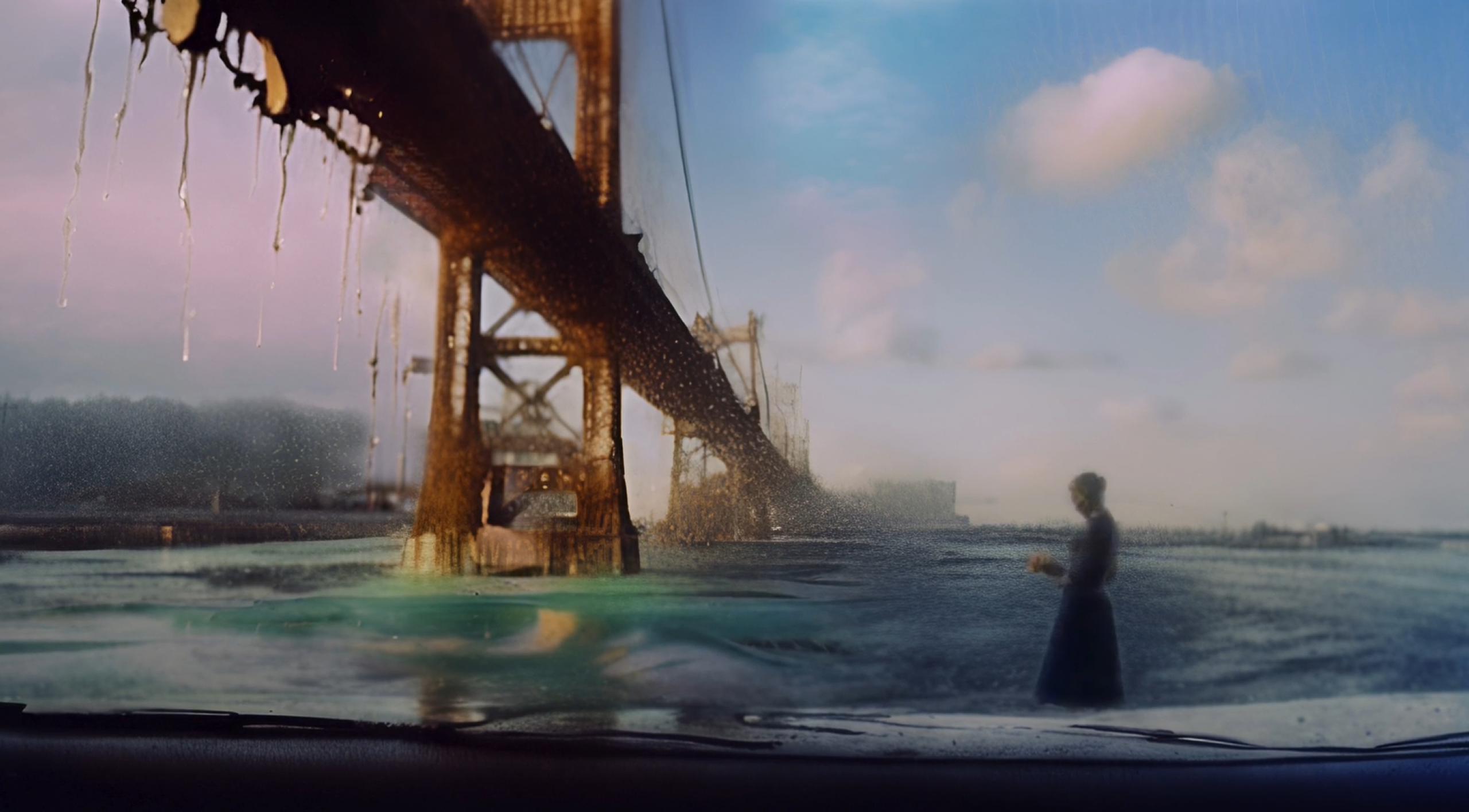 Painting-like representation of a bridge and a figure standing in the water