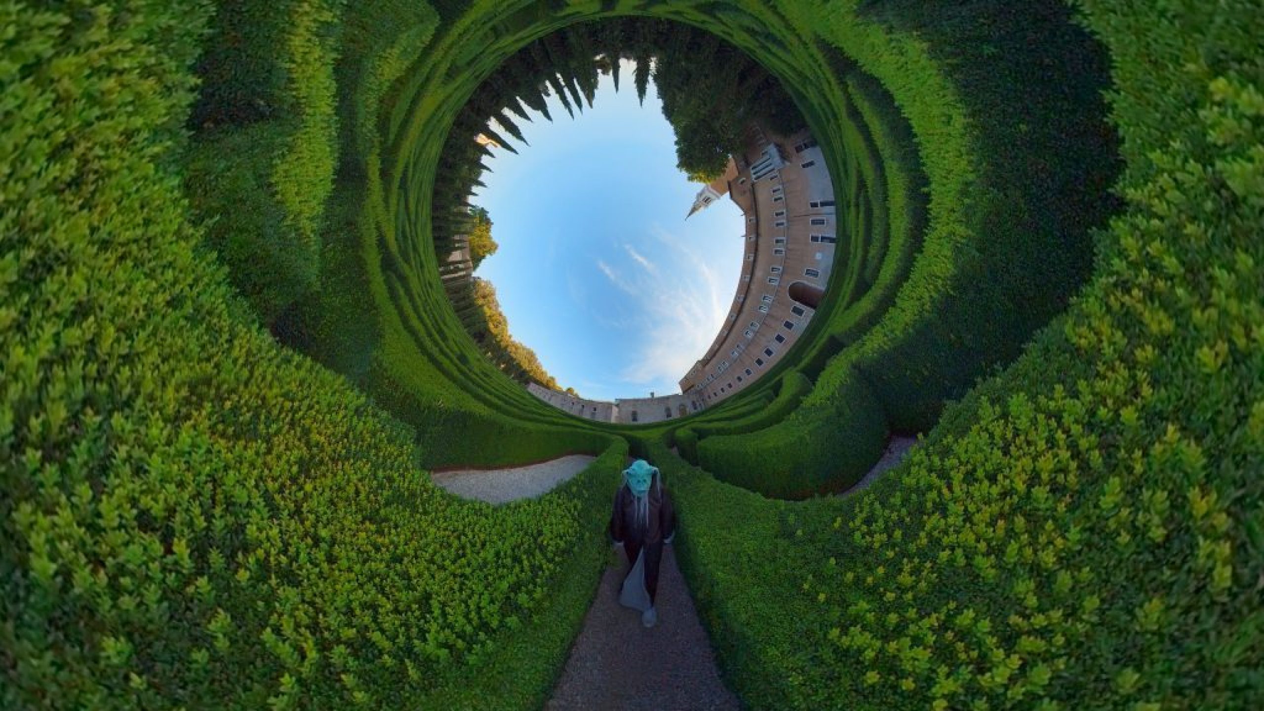 A green alien walking through a warped garden