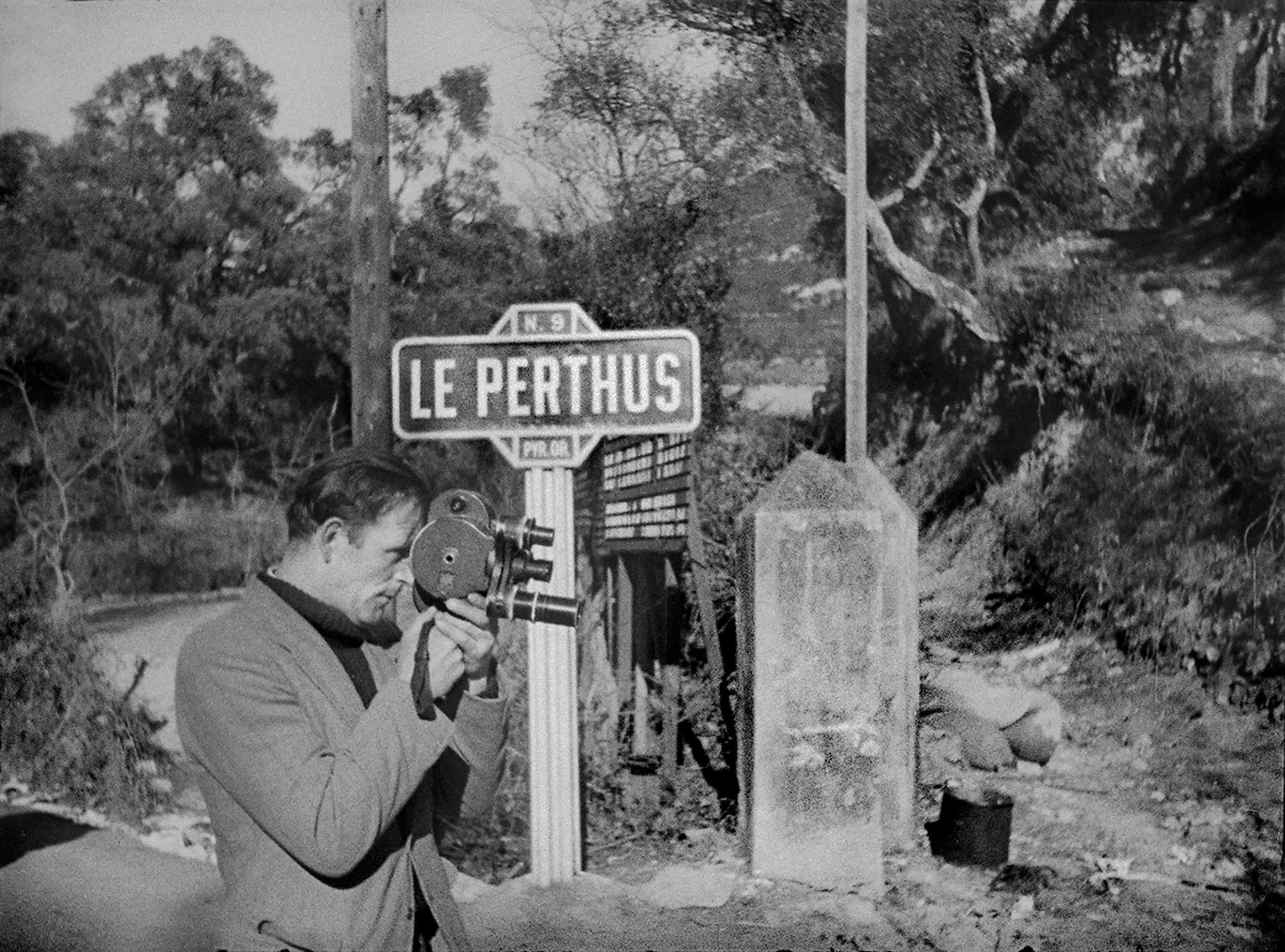 Man looking through an old-timey camera