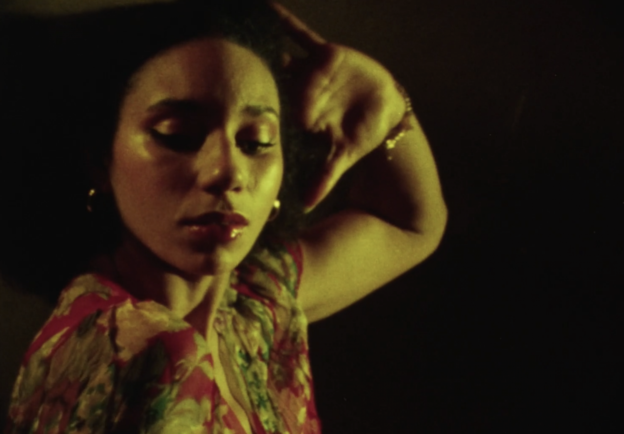 A woman dancing from the neck up