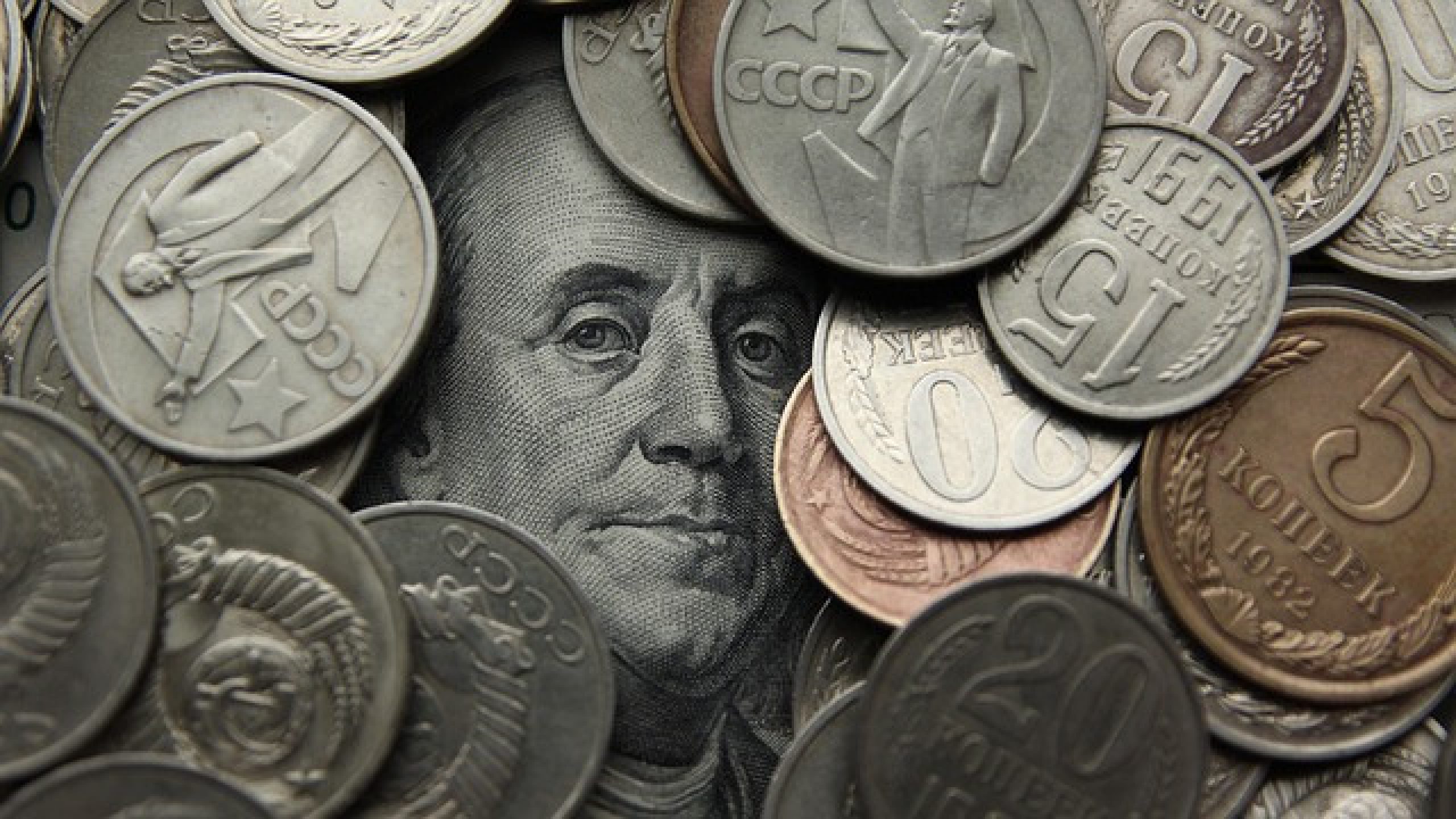 Benjamin Franklin's face framed by coins